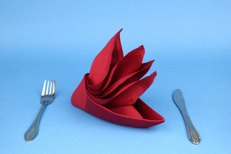 Folded napkin on the blue backgroundの写真素材