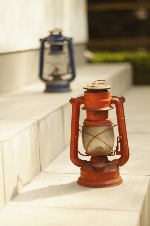 Lanterns in a garden. Red one in focusの写真素材