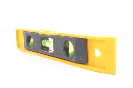 Yellow spirit level isolated on white backgroundの写真素材