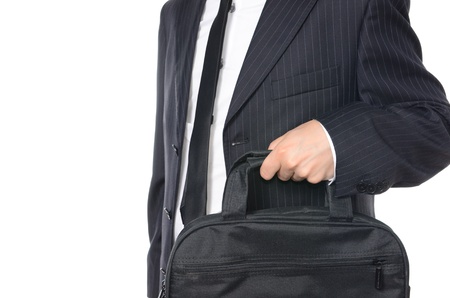 Young businessman holding suitcase isolated on whiteの写真素材