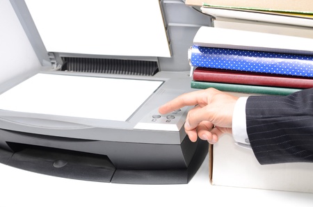 Man in suit using coping machine in office