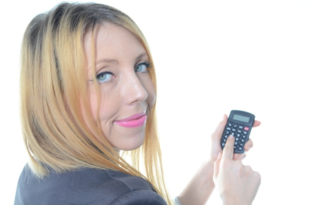 Young businesswoman with calculator isolatedの写真素材