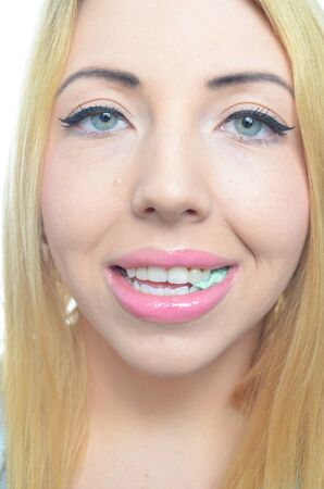Young woman chewing mint gum の写真素材