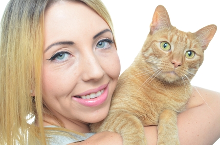 Young woman with cat isolatedの写真素材