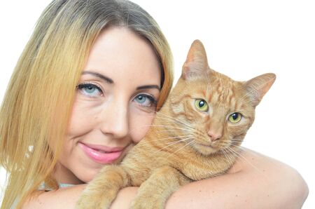 Young woman with cat isolatedの写真素材