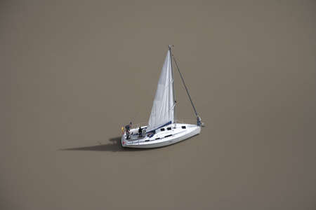 Lonely yacht on river (aerial view)の写真素材