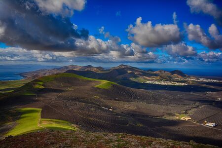 View of the island from the top of volcano, Lanzarote, Canary Islands, Spainの写真素材