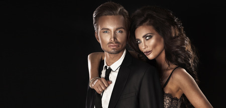 Closeup portrait of handsome luxury couple. Beautiful brunette woman with elegant man.の写真素材