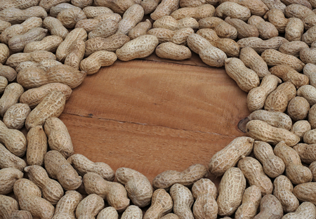 peanuts in a circle on the wooden boards