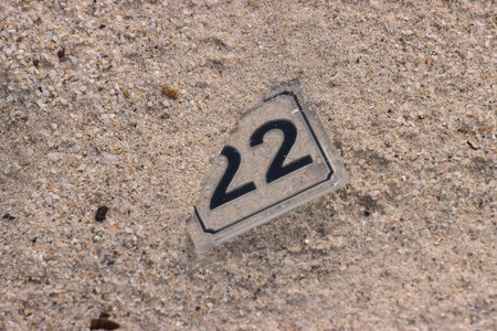 number twenty-two on the sand, close-up of numbersの写真素材