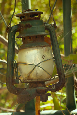 Old kerosene lamp in the garden, closeup of photoの写真素材