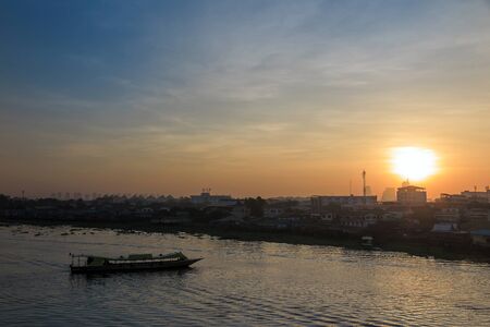 Sunrise with transportation boat in the river, Bangkok, Thailandの写真素材