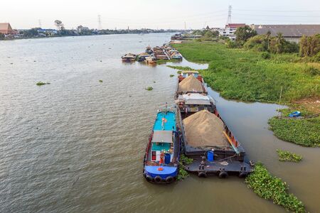 Big barge carry sand in the river near Bangkok Thailand