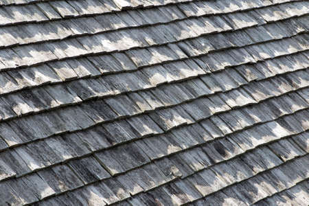 Old brown and grey wooden roof shingles