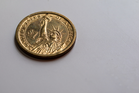 One US dollar coin on white backgroundの写真素材