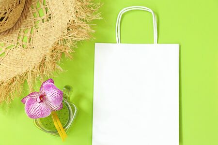 Mockup paper with straw hat on green backgroundのeditorial素材