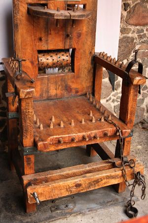 Medieval wooden chair used to torture peopleの写真素材