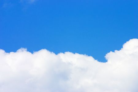 Bright blue sky and a cloudの写真素材
