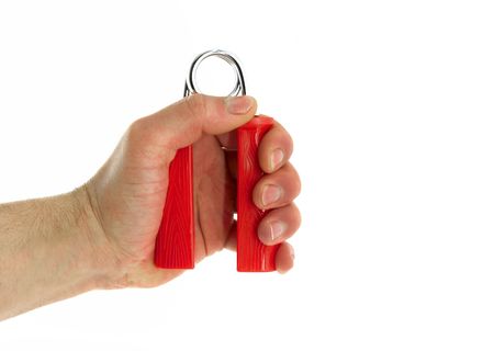 A spring trainer in hand, isolated.の写真素材