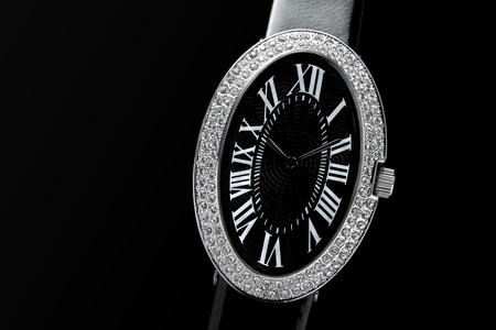 closeup of the luxurious lady's watch a black backgroundの写真素材