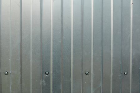Zinc wall background with self-tapping screwの写真素材