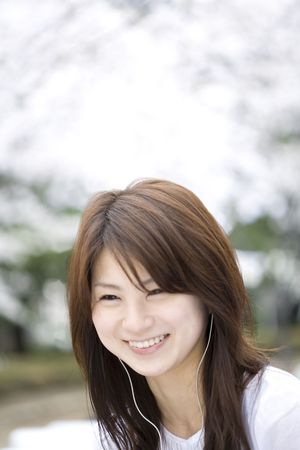Woman under the cherry treeの写真素材