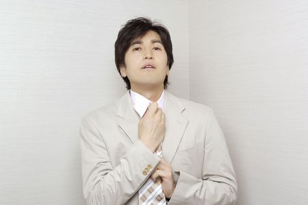 Office worker who shuts a tieの写真素材