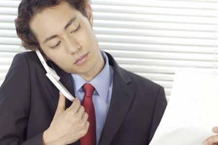 Office worker who receives on the phoneの写真素材