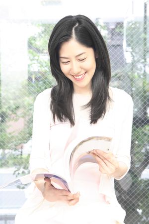 Woman reading a bookの写真素材