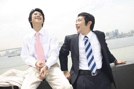 Businessman taking the break during going outの写真素材