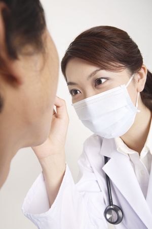 Doctor examiningの写真素材