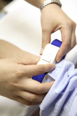 Hand of fastening a beltの写真素材