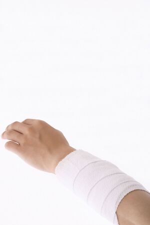 Arm rolled up by bandageの写真素材