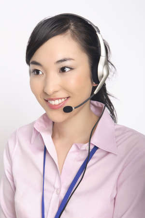 Business lady talking in headsetの写真素材