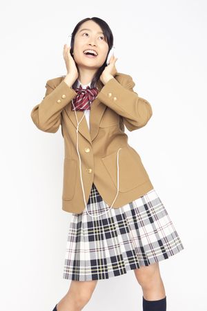 High school girl listening to the musicの写真素材