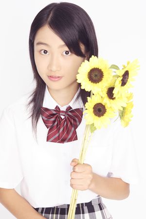 High school girl having sunflowersの写真素材