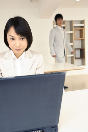 Office lady operating a PCの写真素材