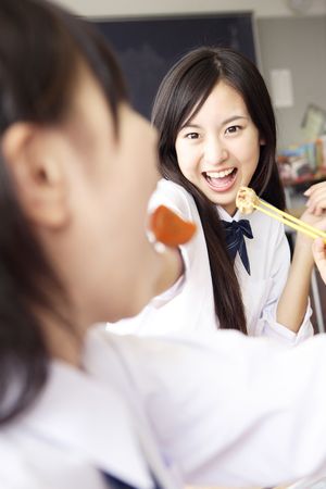 High school girls having lunchの写真素材