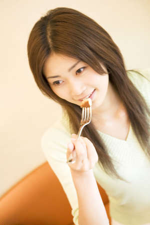 Woman having a meal at a restaurantの写真素材