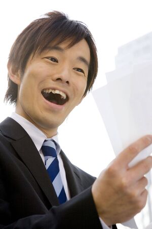 Smiling Japanese office workerの写真素材