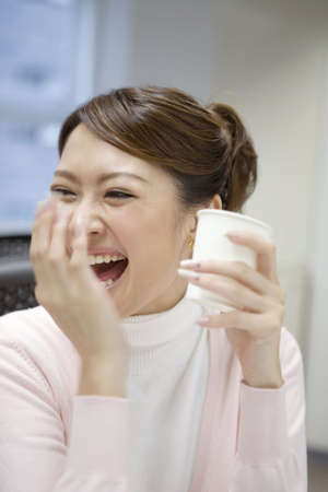Smiling Japanese office ladyの写真素材