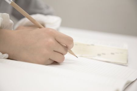 Hand taking a memoの写真素材