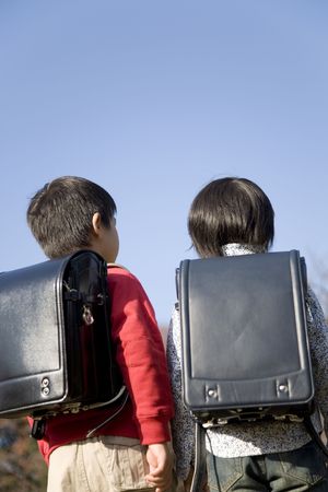 Back figure of Japanese schoolboysの写真素材