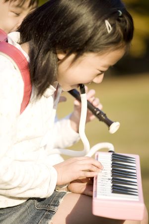 Japanese girls playing the musicの写真素材