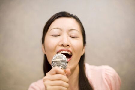 Woman who does karaokeの写真素材