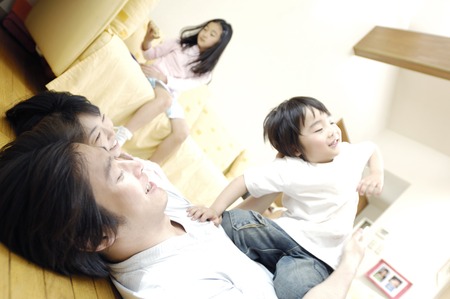 Family in the livingroomの写真素材