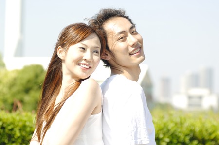 Couple to snuggle up to back to backの写真素材