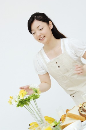 Woman decorating the flowerの写真素材