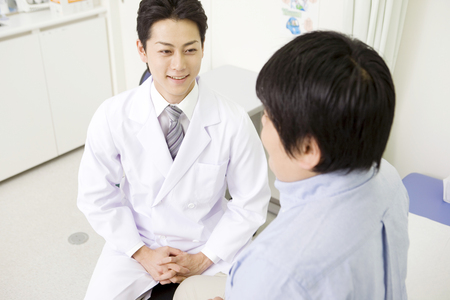 Doctor for examination a male patientの写真素材