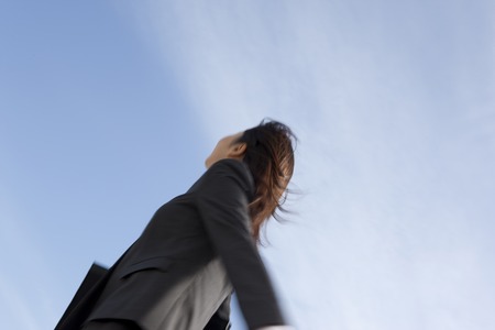 Rear View of OL that run outsideの写真素材